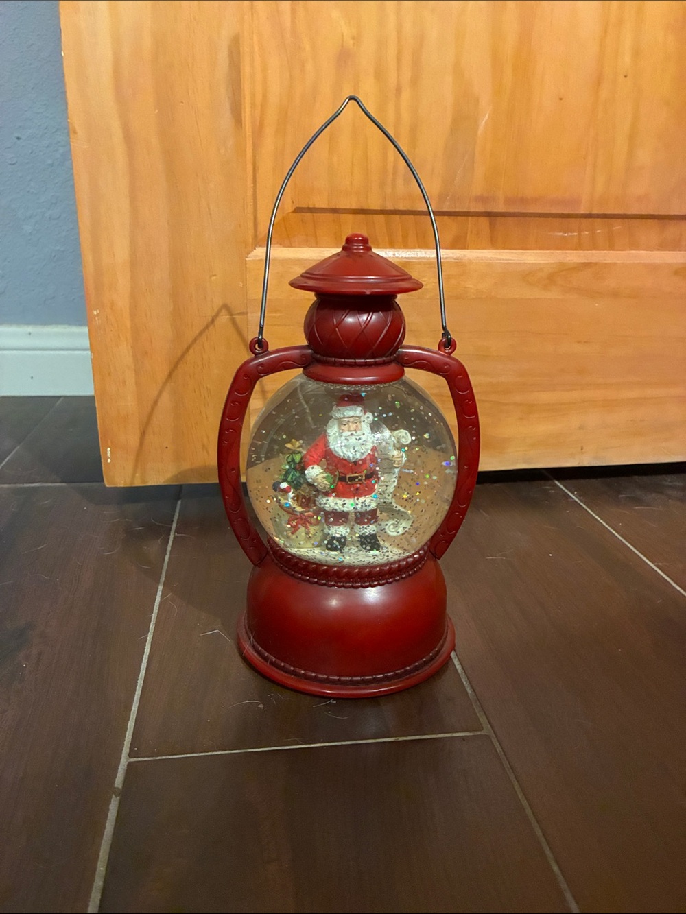 Festive Red Santa Lantern Snow Globe Plays Holiday Music